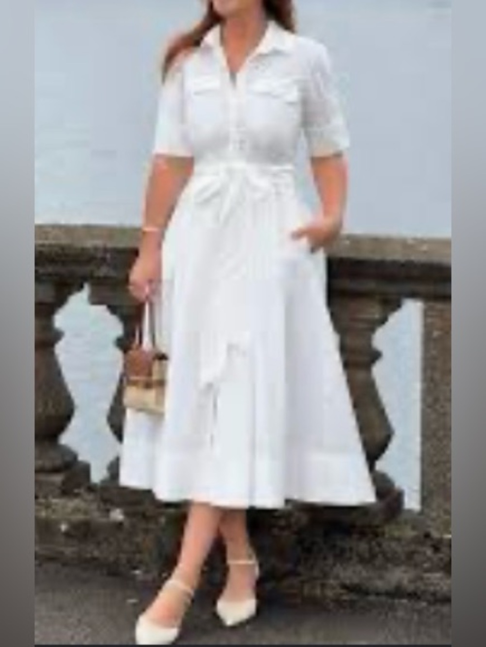 Zara white poplin midi shirt dress. It features a classic collared neckline